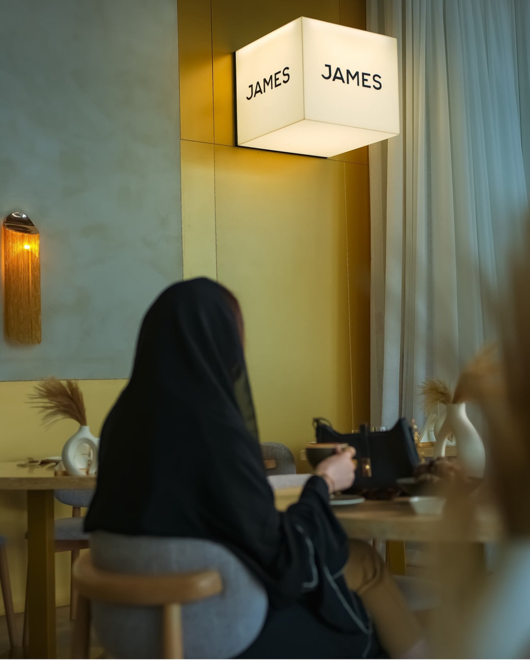 Hand‐pouring soy candles at James Café Al Qana waterfront workshop