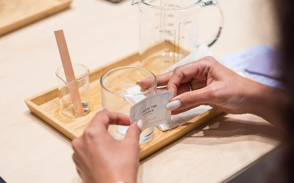 Corporate team enjoying an indoor candle-making workshop during a team-building event in Dubai