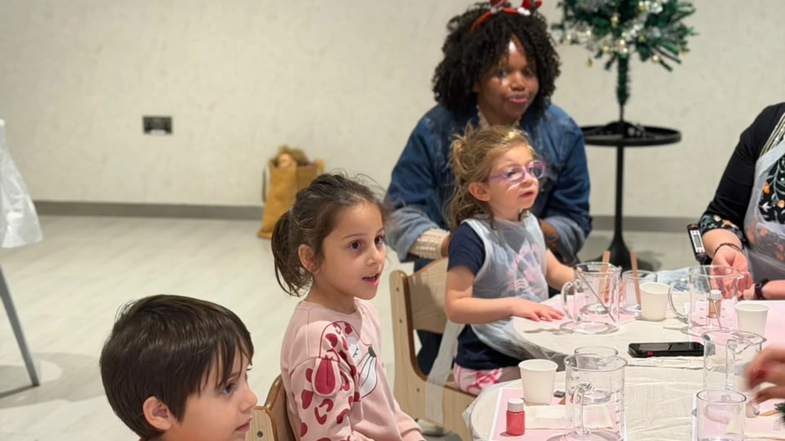 Air-conditioned indoor candle making workshop table setup for children at Studio Kinza Dubai