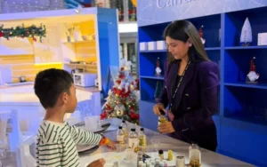 Children crafting and decorating their own handmade soy candles at a weekend workshop in Dubai