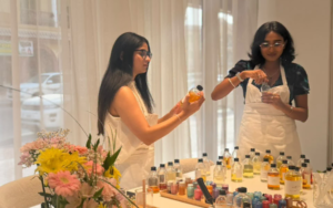 Studio Kinza workshop table setup with artisanal glassware, fragrance accords, and gift vouchers in Dubai