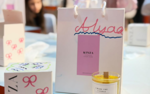 Guest thoughtfully smelling fragrance accords during a personalized workshop experience in Dubai