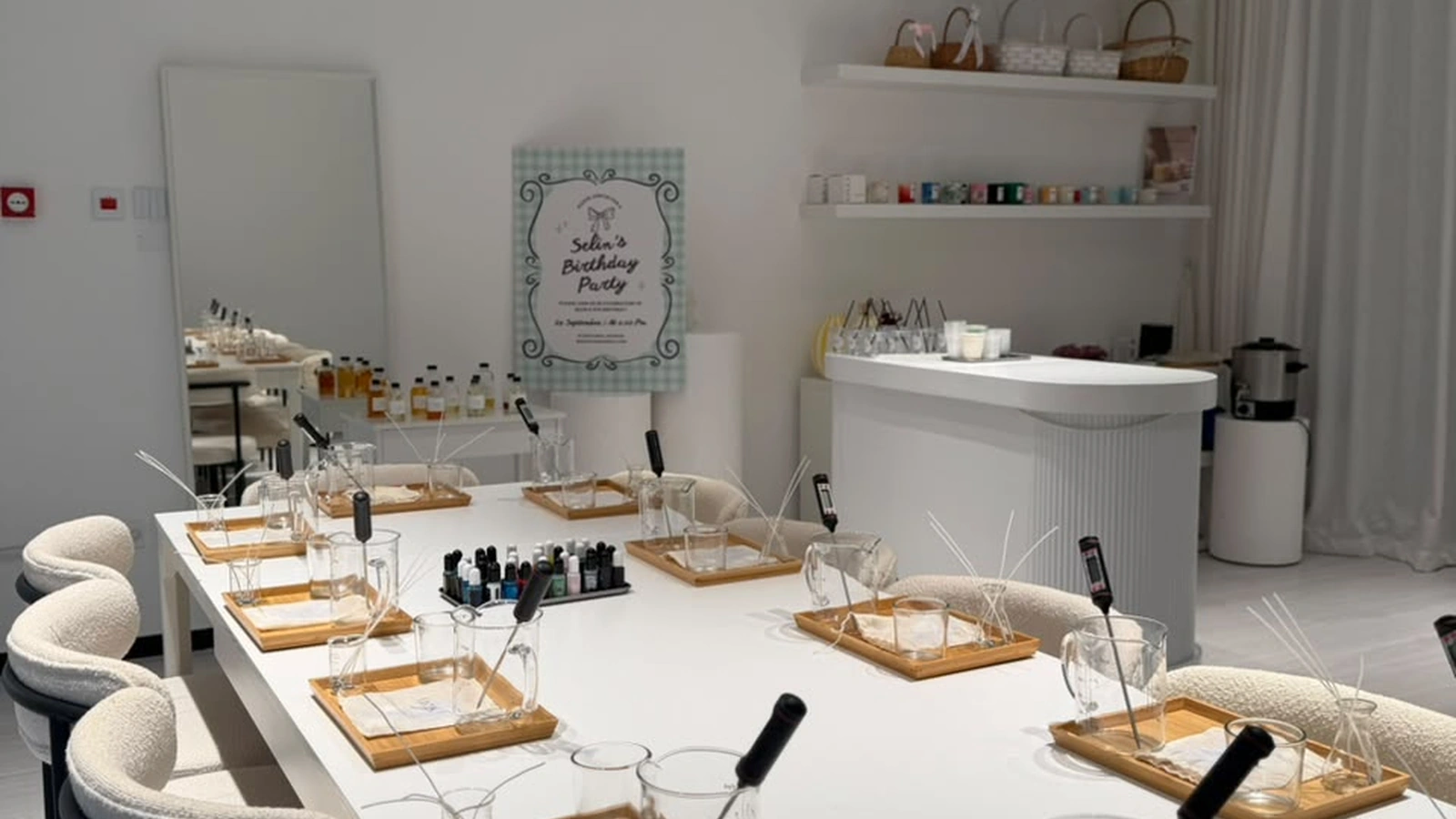Hands-on teen birthday candle workshop table setup with natural soy wax, fragrance oils, and custom labels in Dubai