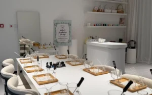 Group of teenagers celebrating a birthday party at an indoor soy candle making workshop in Dubai