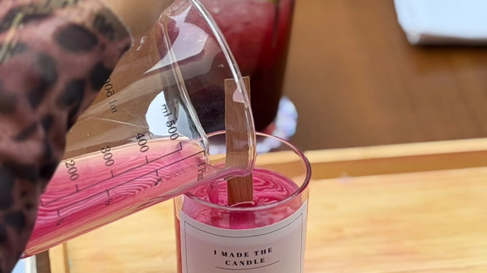 Teenage girls crafting personalized scented soy candles at an aesthetic birthday party workshop in Dubai