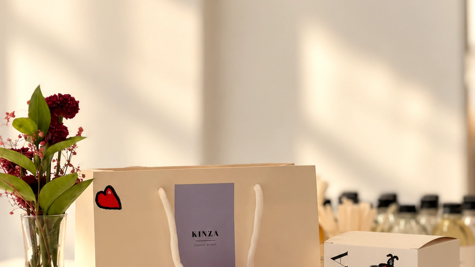 Small group of teenage friends blending fragrances and pouring candles at Studio Kinza Dubai
