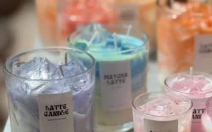 Handcrafted soy candle and Studio Kinza experience gift voucher presented as a creative gift in Dubai