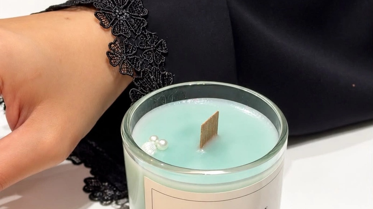 Guest blending custom fragrance oils during a luxury candle making gift experience in Dubai